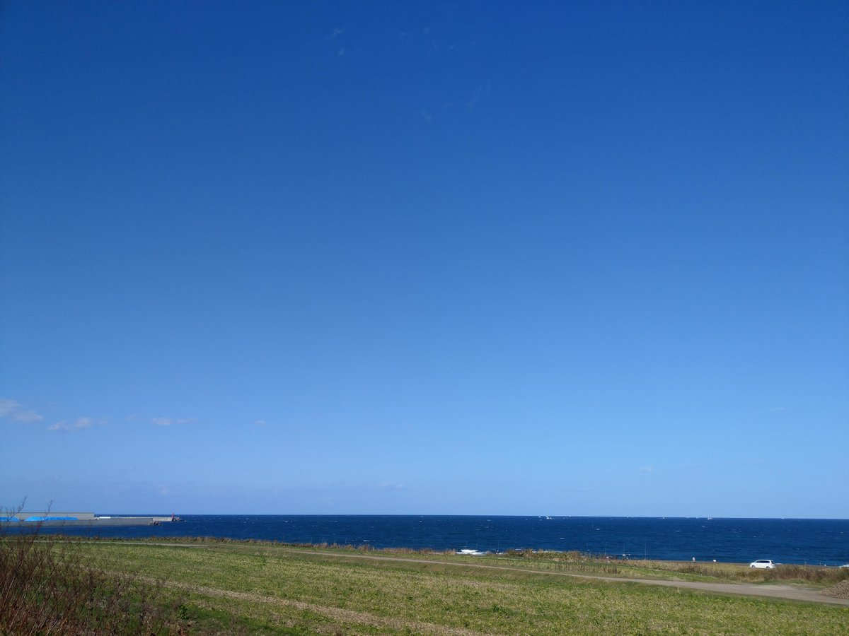 Endless Ocean View Across Hokkaido's Coastal Grassland
